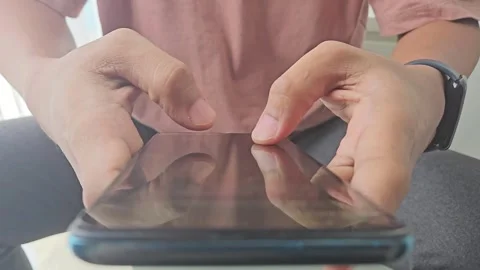 Close up view of man's hands typing a message on a smart phone Stock Footage 288942946