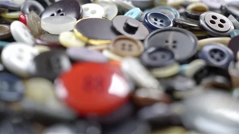 Close up view of many buttons of different colors and shapes. Rack focus Stock Footage 72143593