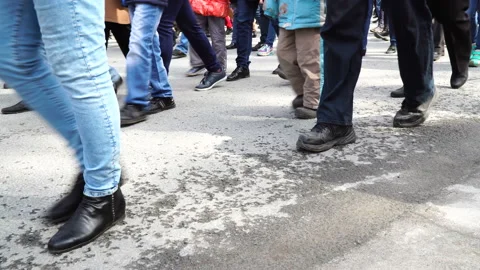 Close up view of many human feet. People walking on the street. Big city Stock Footage 125477993