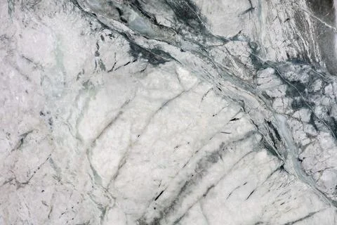 Close view of a marble surface showing white and grey patterns with natural.. 스톡 사진