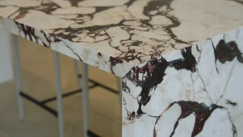 Close up view of marble table with distinctive pattern of dark brown and white Stock Footage 295551184