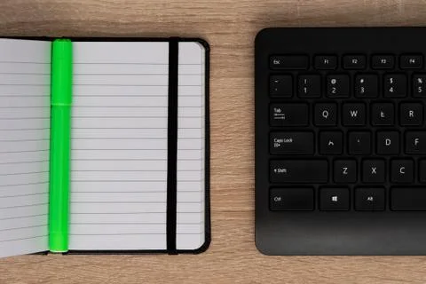 Close up view of marker, notepad and keyboard Stock Photos