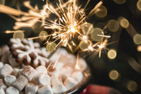 Close view of marshmallow in red cup with sparkler. soft selective focus. abs Stock Photos
