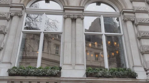 A close up view of massive windows of an old building. Stock Footage 116686771