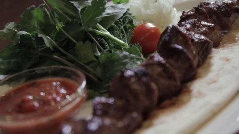 Close-up view of meat and vegetables on the grill Stock Footage 90085881