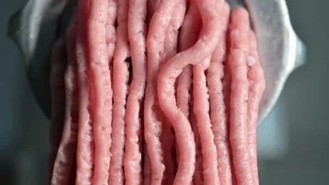Close up view of meat coming out of the meat grinder Stock Footage 142030239