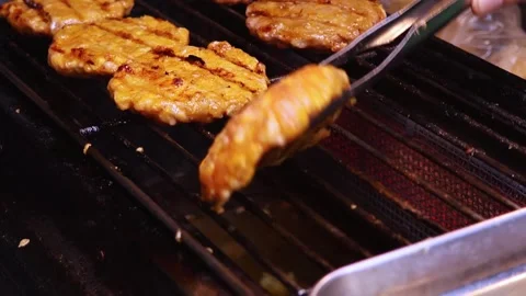 Close-up view of meat patties being grilled. Stock Footage 324874106