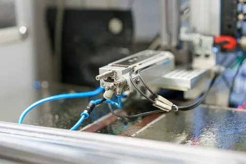 Close view of a mechanical component in a factory setting during a producti.. Stock Photos