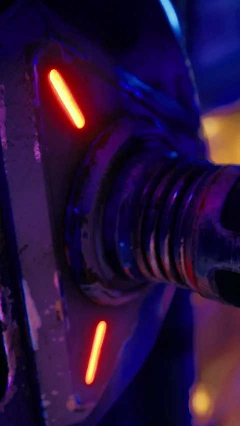 Close view of a mechanical component with glowing details in a workshop setting Stock Footage 331758752