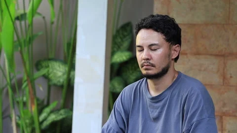 Close up view of meditating man with closed eyes. Stock Footage 159856673