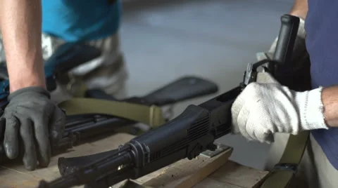 Close view of Men Assembling machine gloved hands Stock Footage 60076348