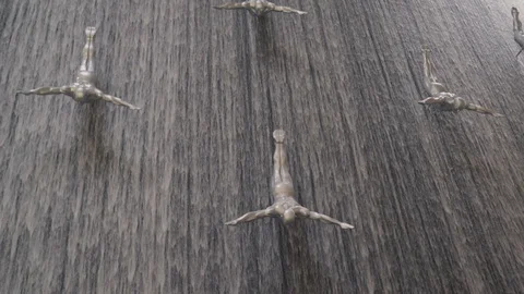 Close-up view of Men falling fountain, inside The Dubai Mall. Stock Footage 126759720