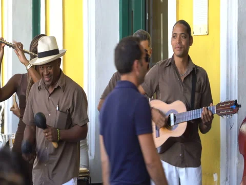 Close-up view men musicians sing salsa melody and play maracas, guitar near Stock Footage 69759383