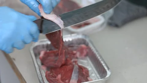 Close up view on men's hands preparing meat for BBQ.  Stock-Footage 242242201