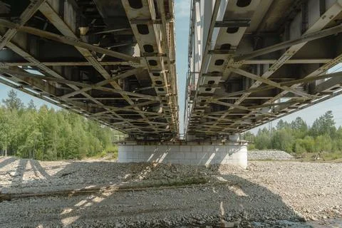 Close-up view of metal bridge structure from below Stock Photos
