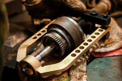 Close-Up View of Metal Gear Puller Tool Extracting Automotive Part on Workben Stock Photos