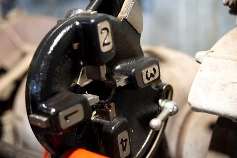 Close up view of metal thread cutter. Hi-technology parts manufacturing process Stock-Fotos