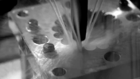 Close-up view of metallic component with screw holes and possible welding seams Stock Footage 308633565