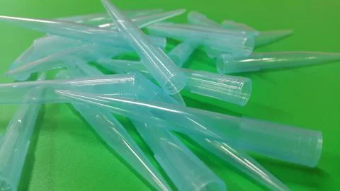 Close up view of micro litre tips on green floor sheet with empty holes. Rese Stock Photos