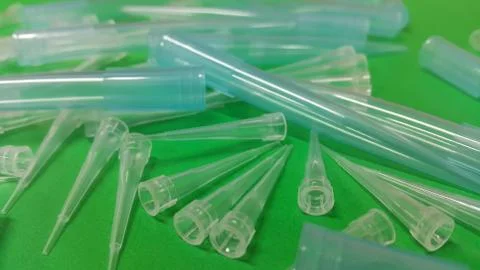 Close up view of micro litre tips on green floor sheet with empty holes. Rese Stock Photos