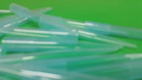 Close up view of micro litre tips on green floor sheet with empty holes. Rese Stock Photos