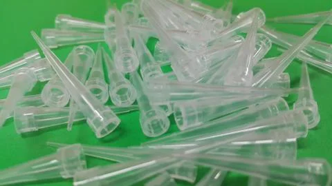 Close up view of micro litre tips on green floor sheet with empty holes. Rese Stock Photos