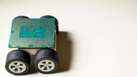 Close-up view of a microprocessor or CPU on 4 wheels Stock Footage 167657771
