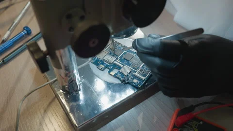 Close-Up View of Microscope Examining Circuit Board in Lab Stock Footage 282302130