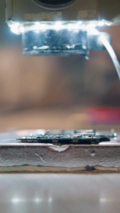 Close-Up View of Microscope Focusing on Circuit Board with LED Lights Video stock 310491104