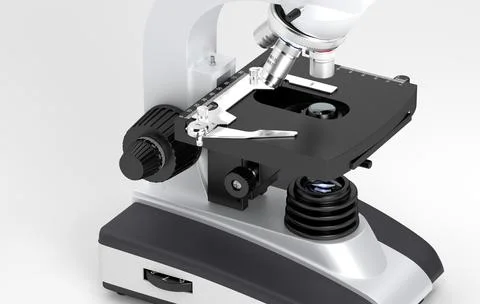 Close view of a microscope showing the objective lenses and stage, used in Stock Illustration