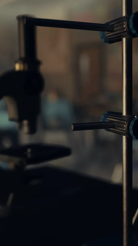 Close view of a microscope on a table in a laboratory setting during daylight Stock Footage 340262859