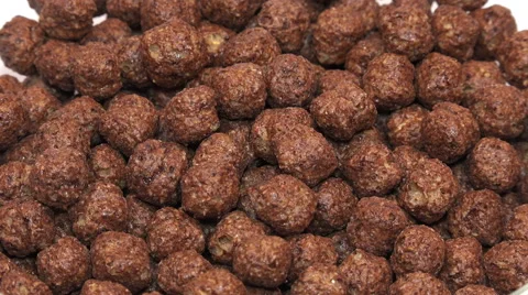 Close-up View of Milk Pouring into Chocolate Corn Flakes. 4K Stock Footage 46167579