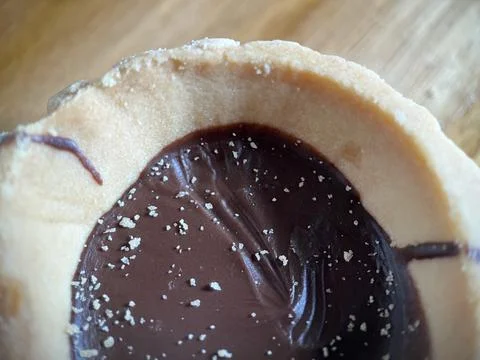 Close up view of mini chocolate pie on wood surface Stock Photos