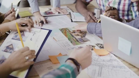Close-up view of mixed race group of people working at the table. Team Stock Footage 75052250