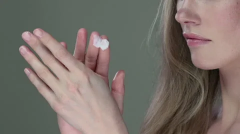 Close up view of model appyling cream to hands. Stock Footage 63027640