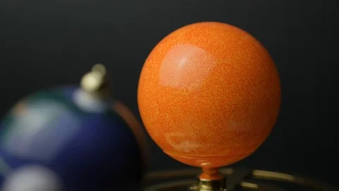 Close-up view: Model of the sun, earth and moon in miniature. Rotation of the Stock Footage 102896161