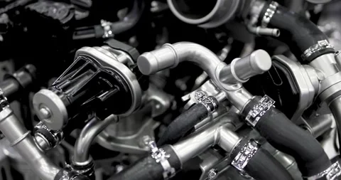 Close up view of Modern automotive engine pipe lines in monochrome Stock Footage 313779079