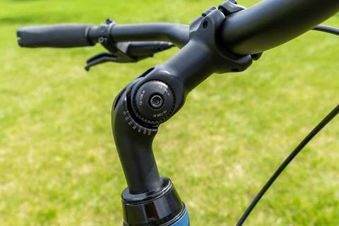 Close-up view of a modern black adjustable bicycle handlebar stem assembly,.. Fotos Stock