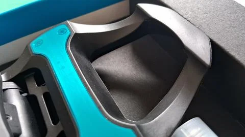 Close up view of a modern black and teal gaming mouse Stock Photos