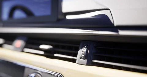Close view of modern car dashboard control features during daylight 스톡 일러스트