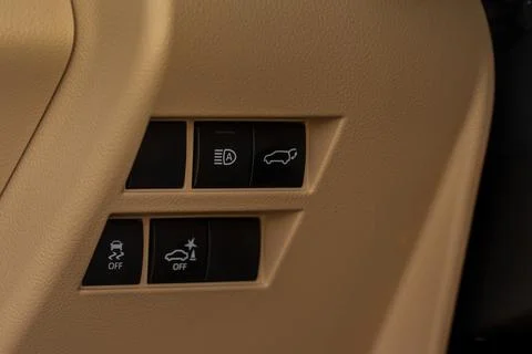 Close up view of modern car electronic safety systems control panel. Modern c Stock Photos
