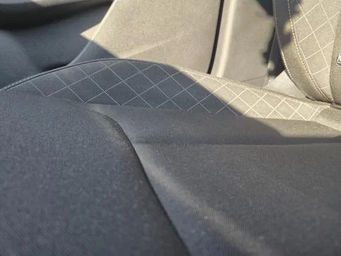 Close-up view of modern car interior seat fabric showcases intricate patterns Stock Photos