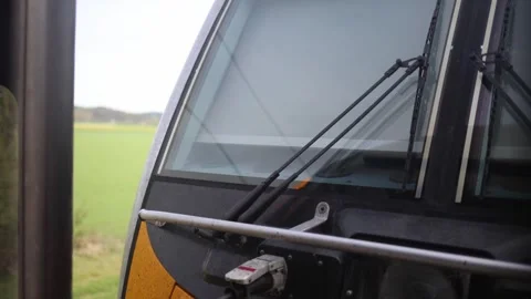 Close view of modern electric train windshield with wipers and power connectors  Stock Footage 307699839