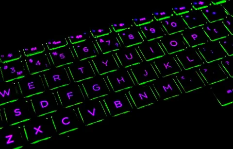 Close up view of a modern laptop computer keyboard keys. Soft lightning in re Stock Photos