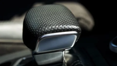 Close-up view of modern luxury car automatic gear selector lever, featuring Video stock 342919187