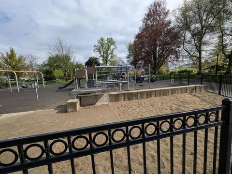 Close-up view of a modern playground featuring colorful slides, swings Stock-Fotos
