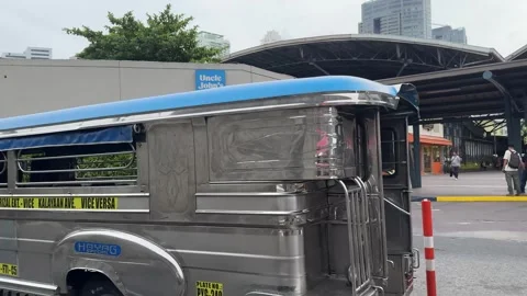 Close up view of a modern public jeepney on Taguig street 4K Stock Footage 337950936