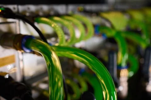 Close-up view of modern server hardware with liquid cooling pipes ensuring op Stock Photos