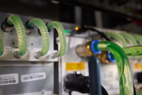 Close-up view of modern server hardware with liquid cooling pipes ensuring op Stock Photos