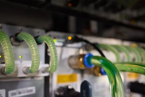 Close-up view of modern server hardware with liquid cooling pipes ensuring op Stock Photos